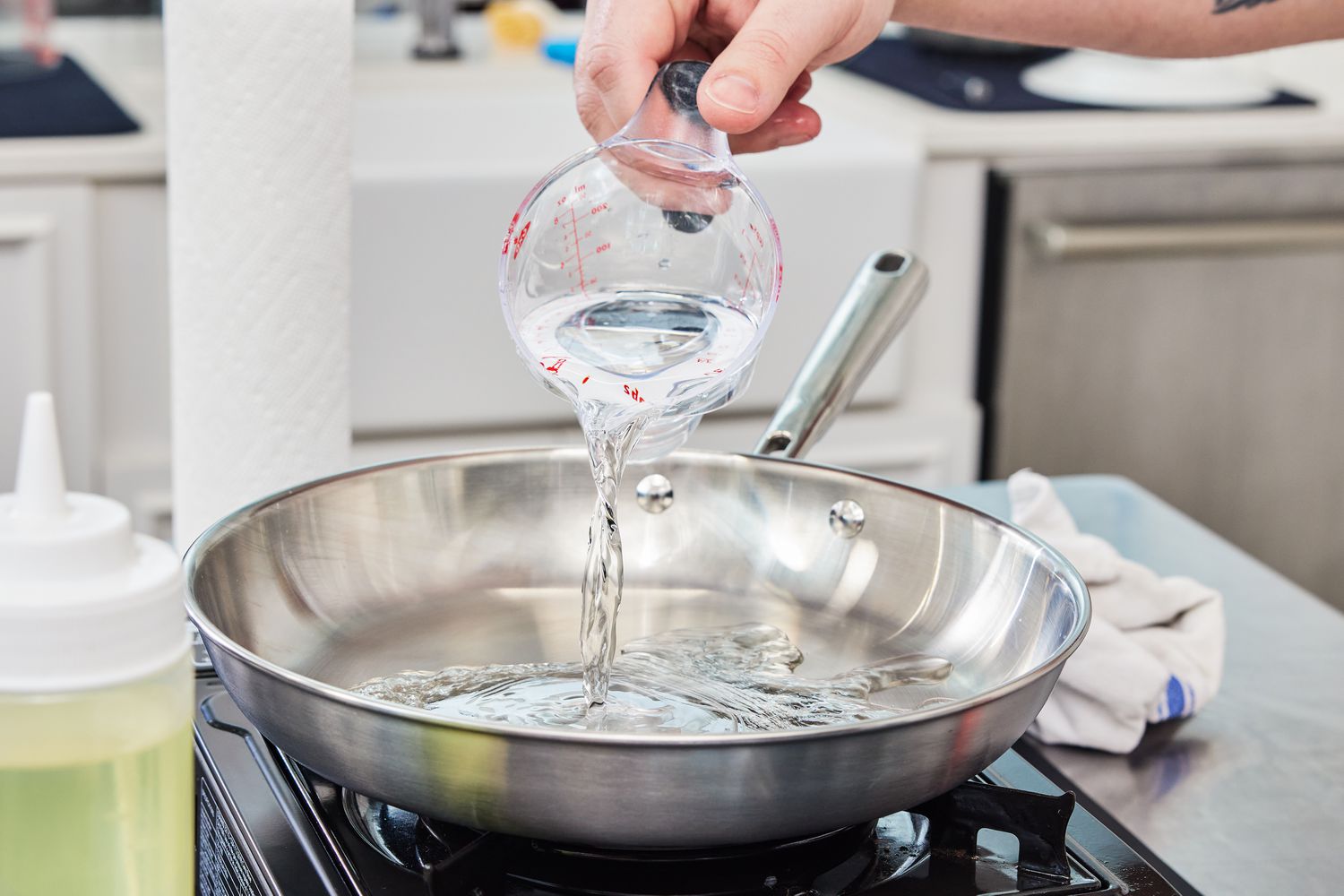 Pouring water in the Misen skillet during testing