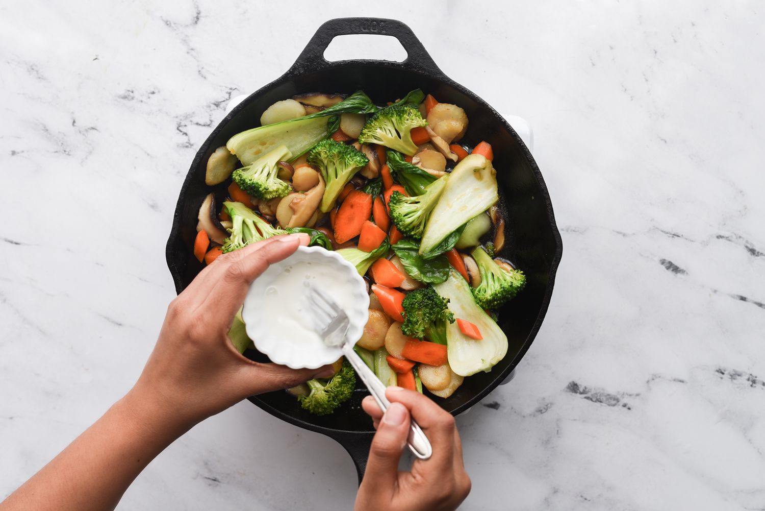 add cornstarch mixture into the vegetable mixture in the pan