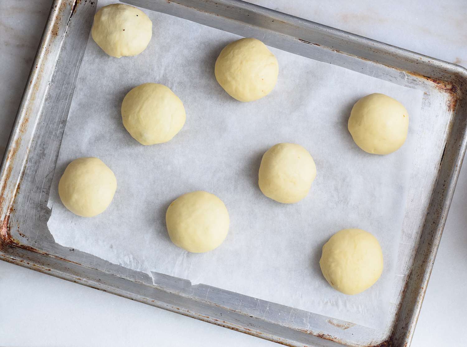 unbaked bierock placed on parchment lined baking sheet