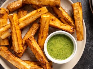 Caribbean Cassava (Yuca) Fries on a plate with a dipping sauce