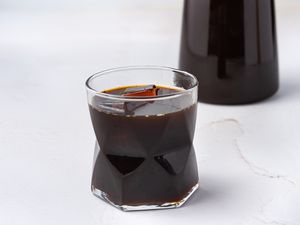 Homemade coffee liqueur in a glass with ice