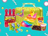 Photo composite of '90s-style lunchbox with squeezits, gushers, HiC, cosmic brownies, and Trix Yogurt