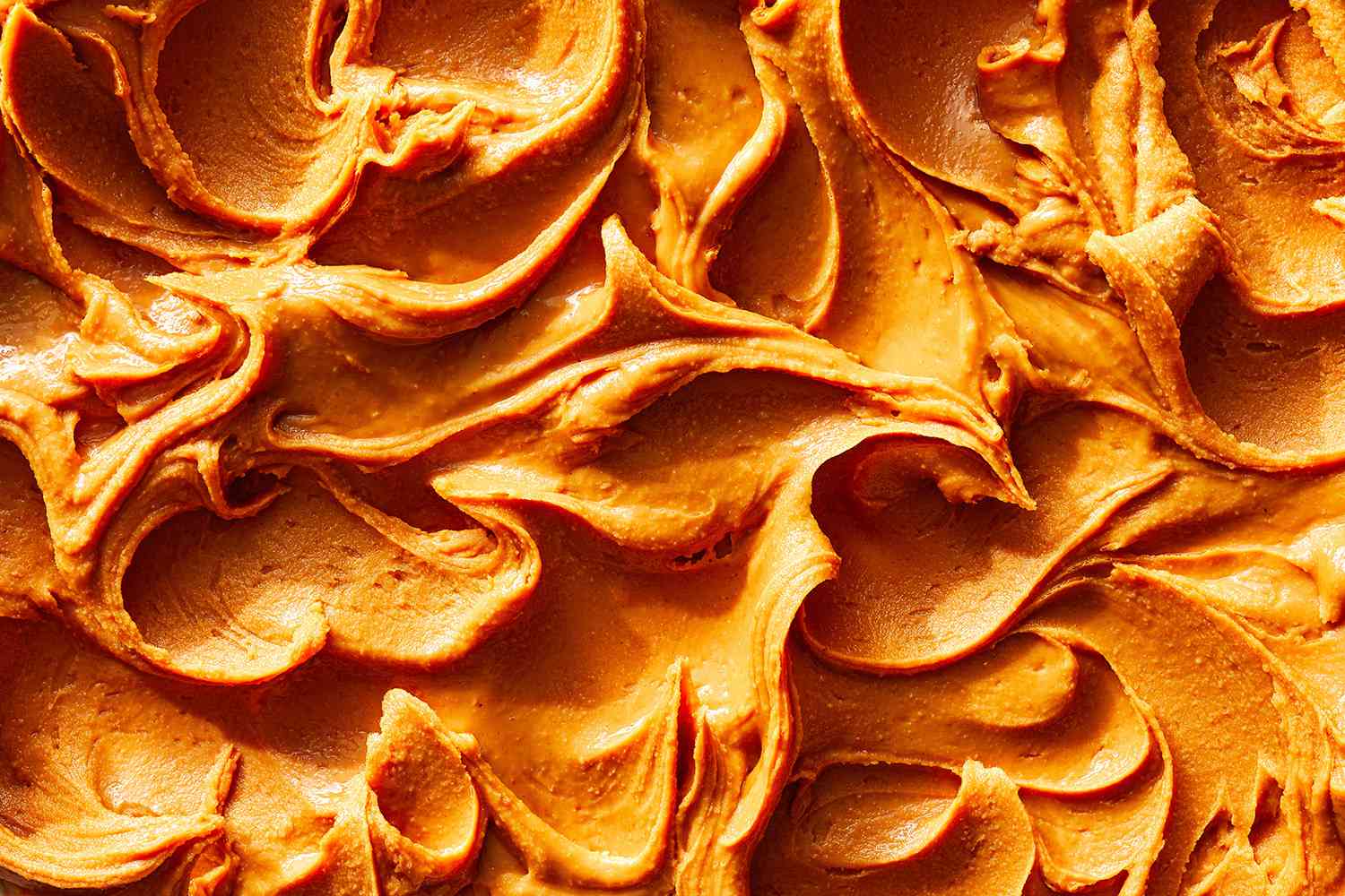 full bleed image of peanut butter spread with peaks