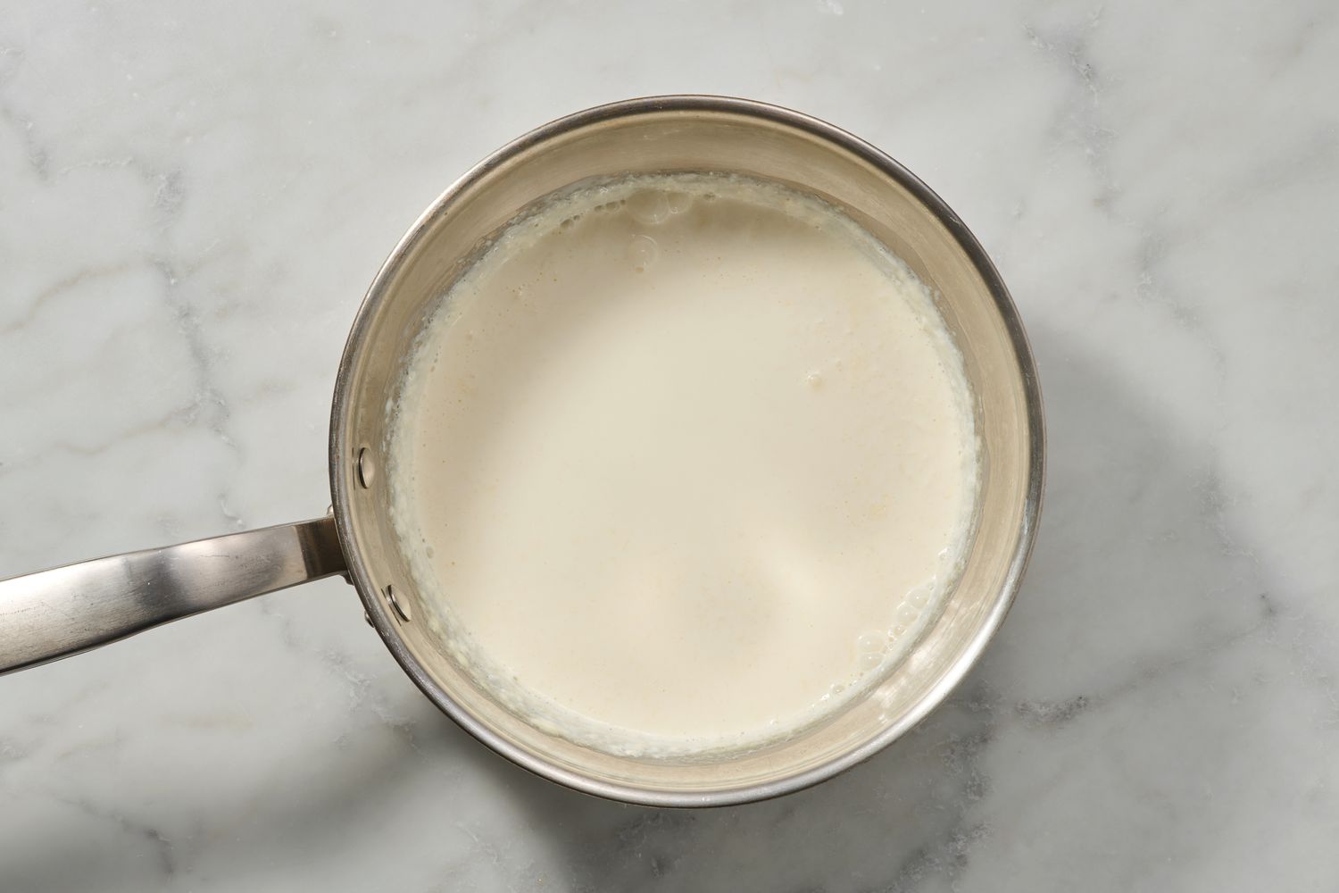 A large pot of simmering cream