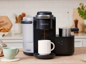 Keurig K-Café Single-Serve K-Cup Coffee Maker brewing a cup of coffee on a kitchen counter 