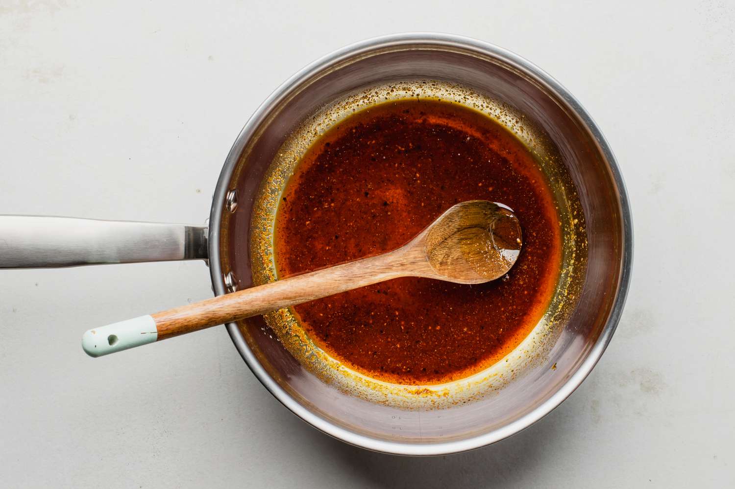 Salt, sugar, and pepper added to melted butter for spicy roasted cauliflower