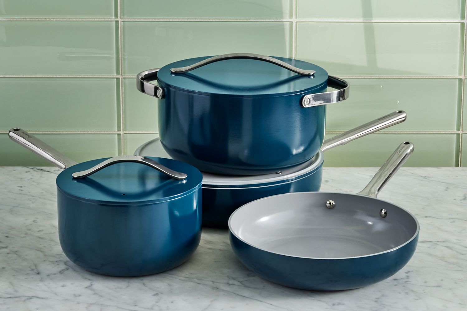 Caraway Cookware Set displayed on marble countertop
