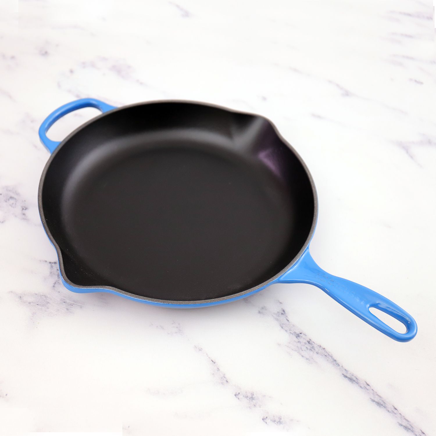 Le Creuset Signature Skillet on a marble counter