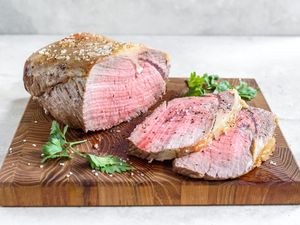 Slow-roasted prime rib roast recipe cut on a wooden board
