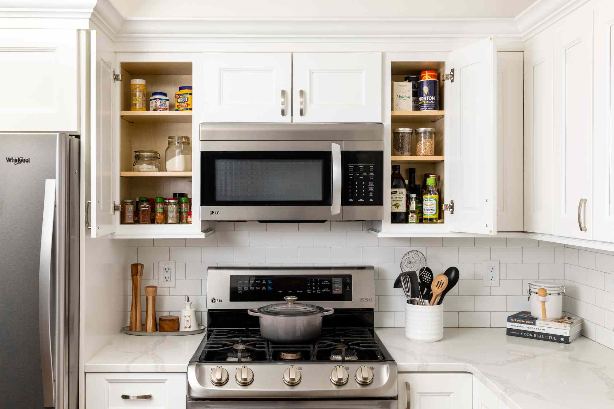 cabinets adjacent to the stove with items used most frequently