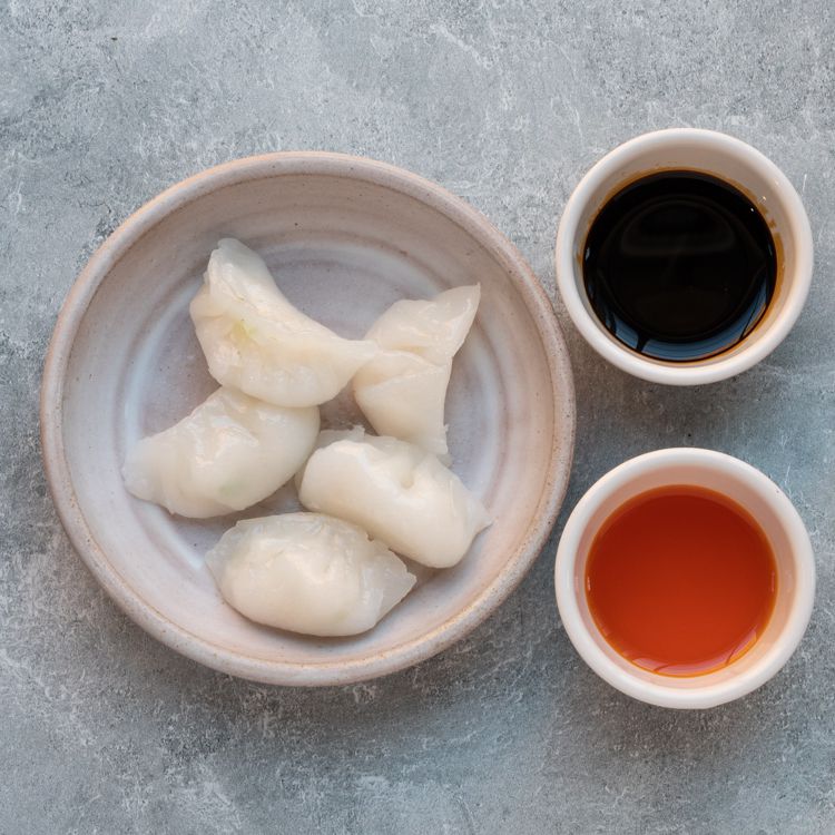 Chinese Shrimp Dumplings (Har Gow) in a beige bowl