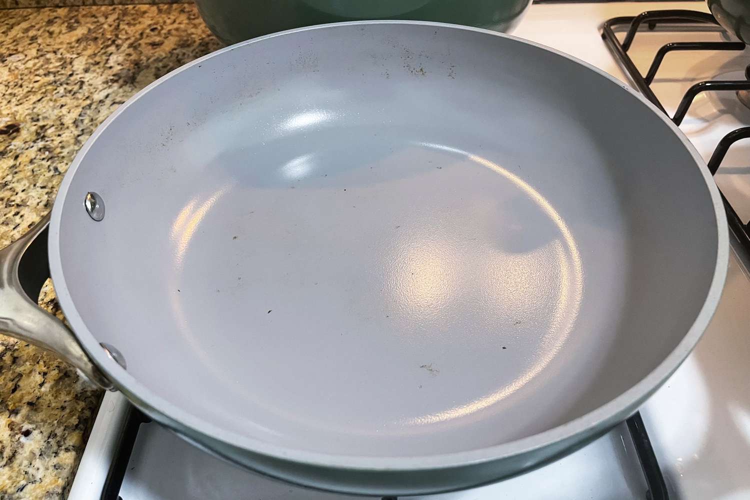 Caraway frying pan after 18 months of use, small dark spots on coating