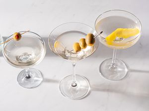 Three dirty martinis in glasses
