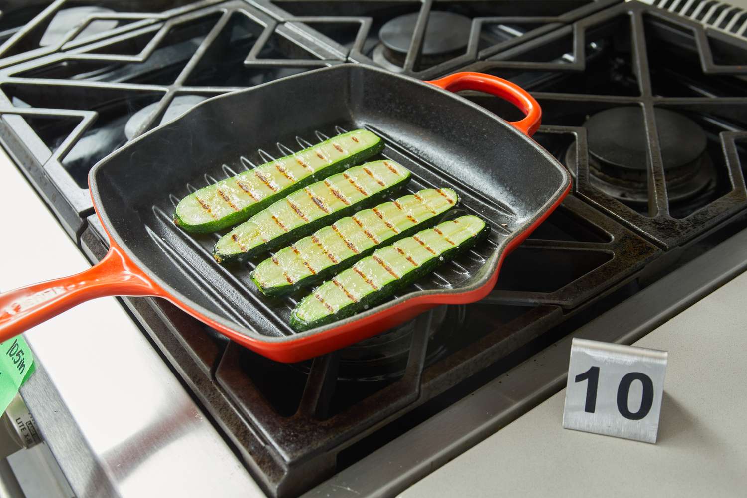 Zucchinis being cooked in the Le Creuset Square Skillet Grill Pan.