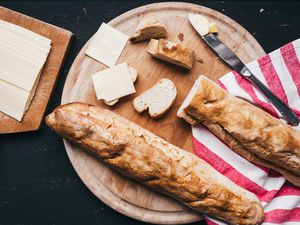 Two traditional Italian bread loafs on a cutting board