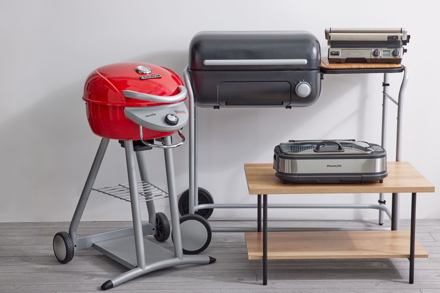 Best electric grills displayed indoors on gray floor