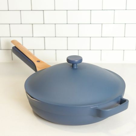 An Always Pan 2.0 in muted blue on a white countertop