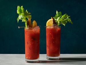 Two bloody marys on a dark background