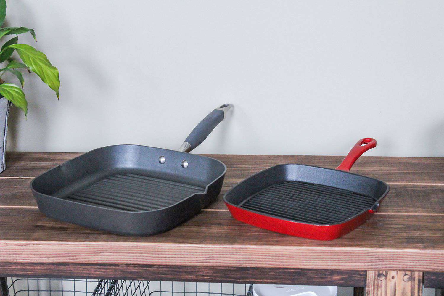 Anolon Advanced Nonstick Square Grill Pan next to the Cuisinart Chef's Classic Grill Pan