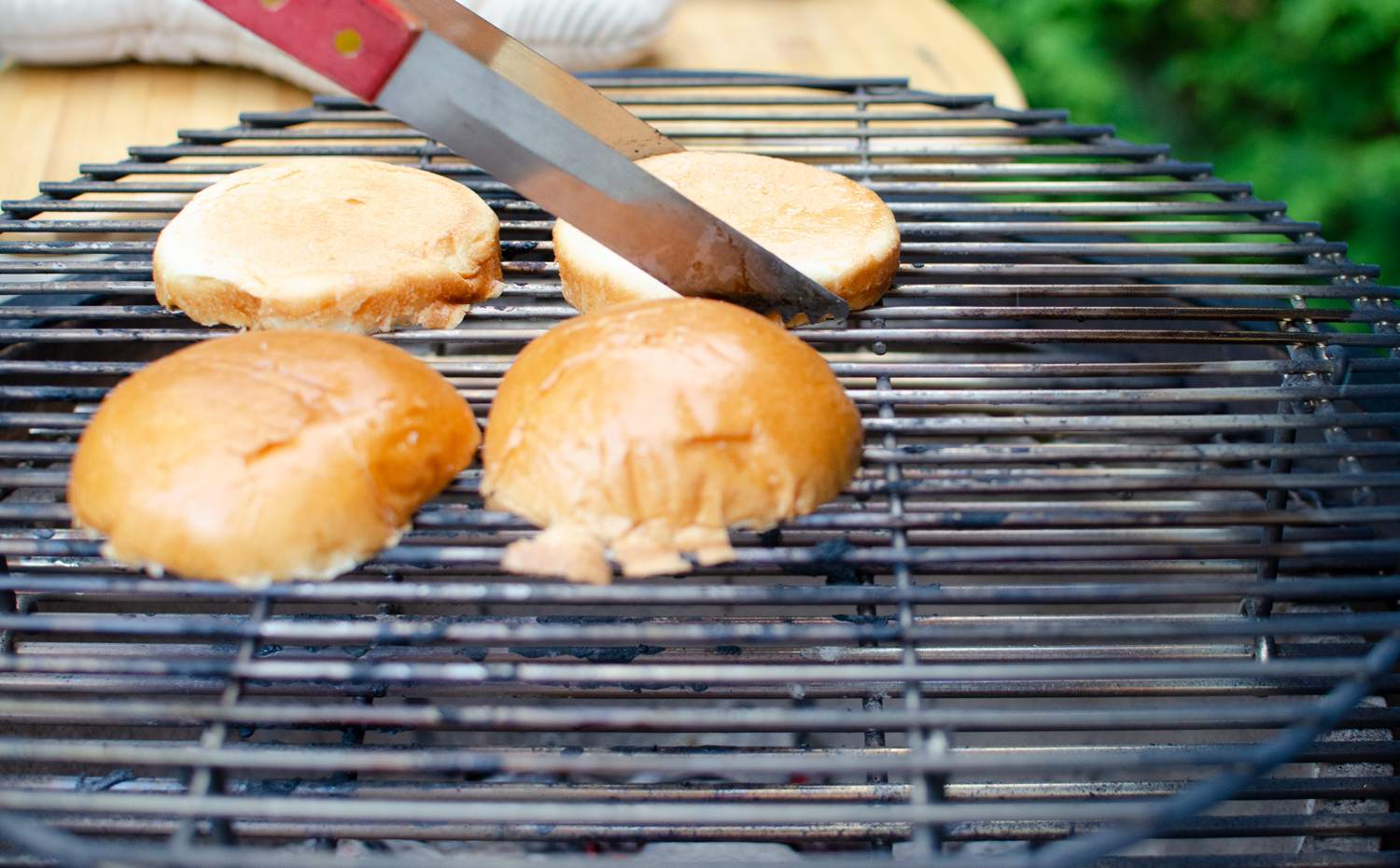 Louisiana Grills K22 Ceramic Kamado with burger buns on grate