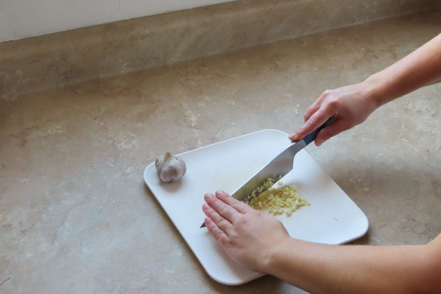 misen chef's knife after finely chopping onion