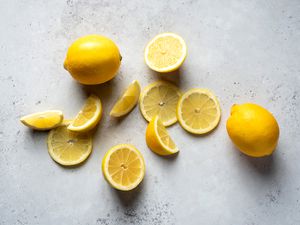 Lemon slices, wedges, and whole lemons