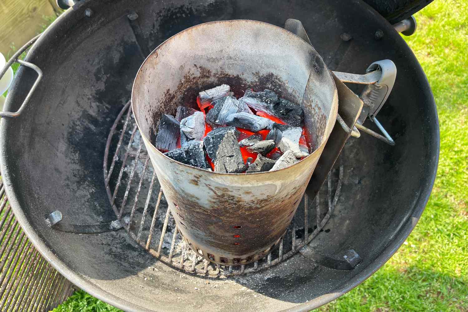 Big Green Egg Natural Oak and Hickory Lump Charcoal burning in a grill