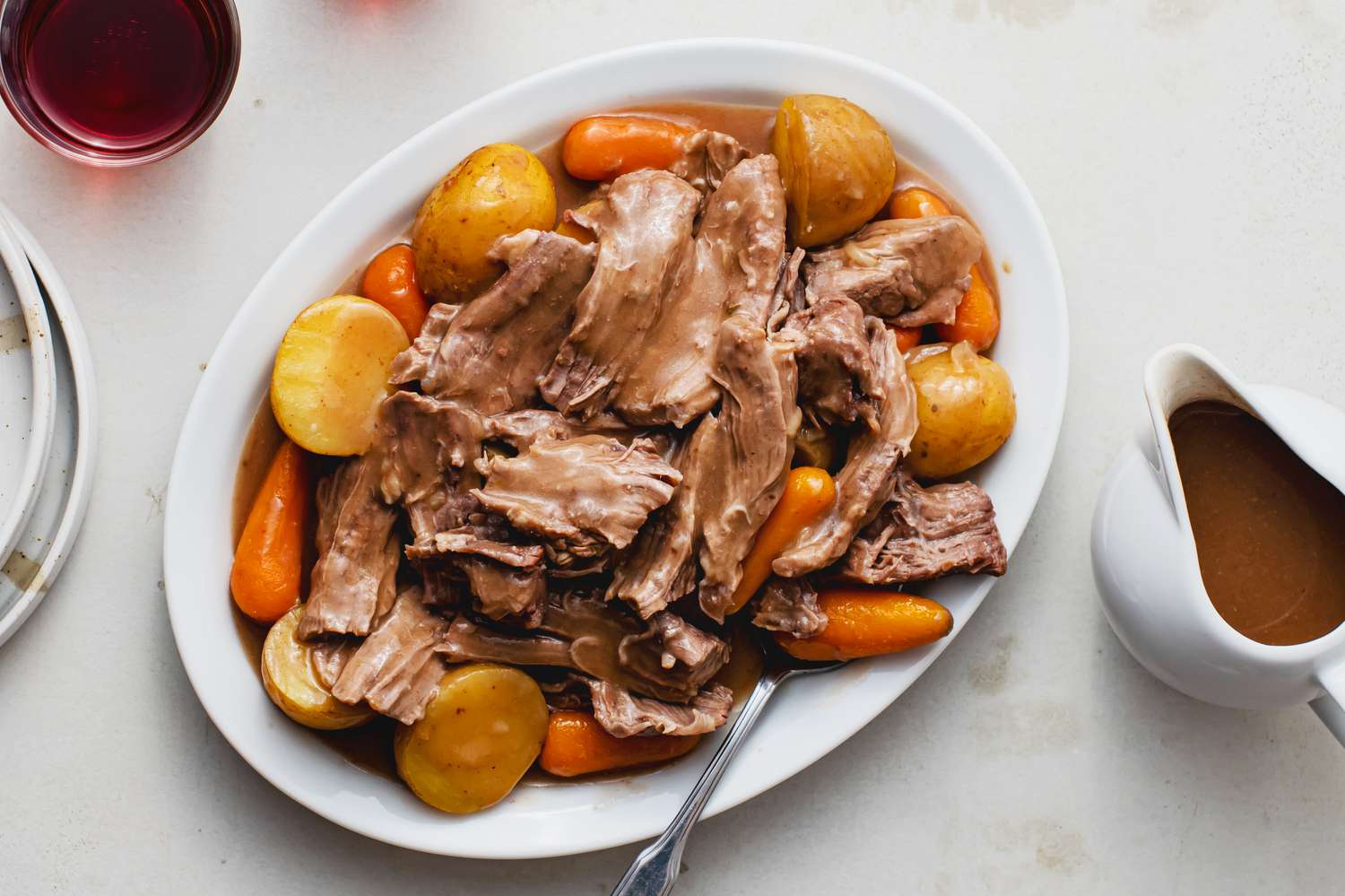 Crock Pot Onion Soup Beef Pot Roast recipe, on a white plate