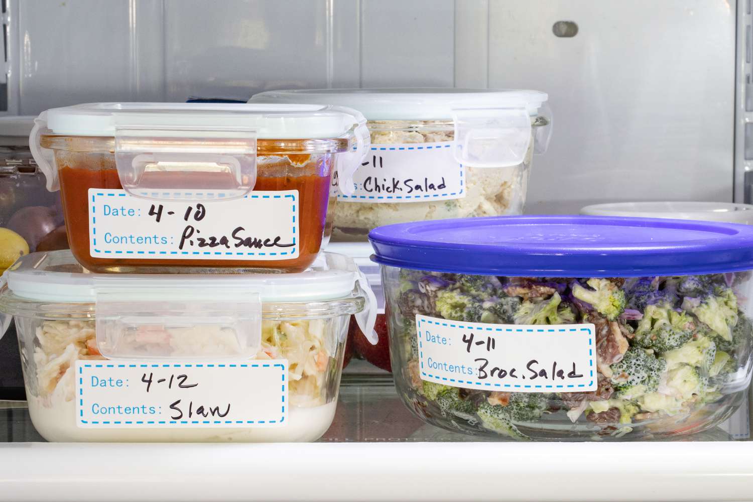 Refrigerator containers with labels.