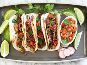 Instant Pot carnitas in flour tortillas.