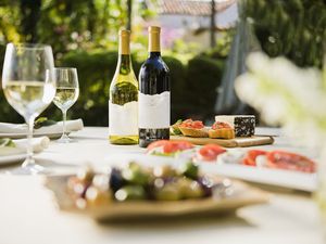 Wine glasses with wine bottles on a table