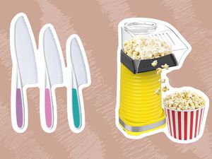 A set of knives and a popcorn maker on a brown background