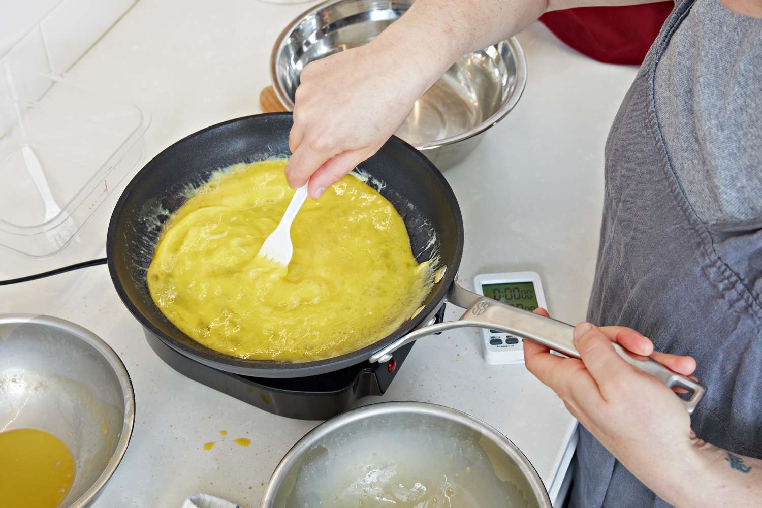 Omelet being made in a pan from the Calphalon Signature Nonstick 10-Piece Cookware Set