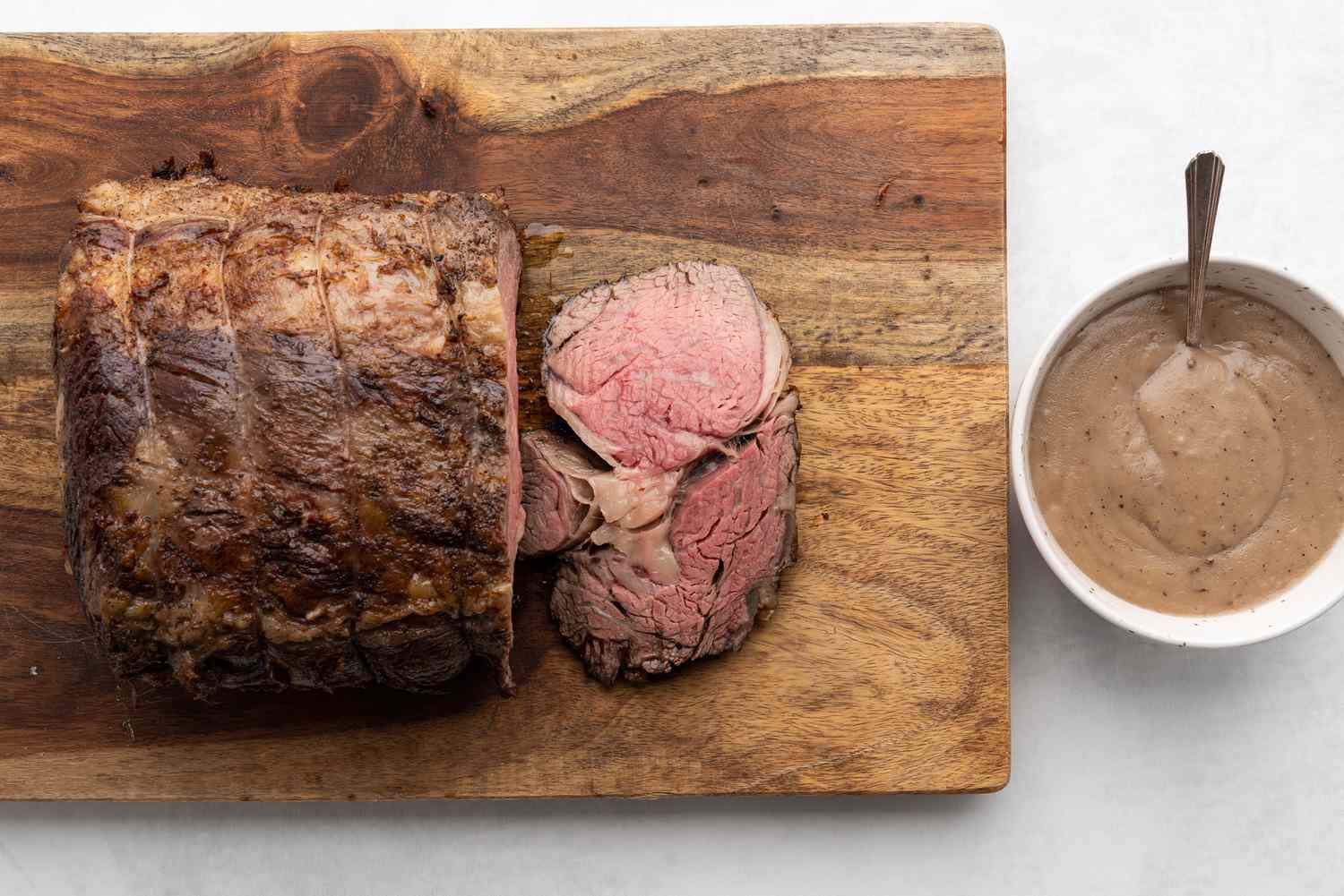 Instant Pot Prime Rib Roast served with gravy in a bowl 