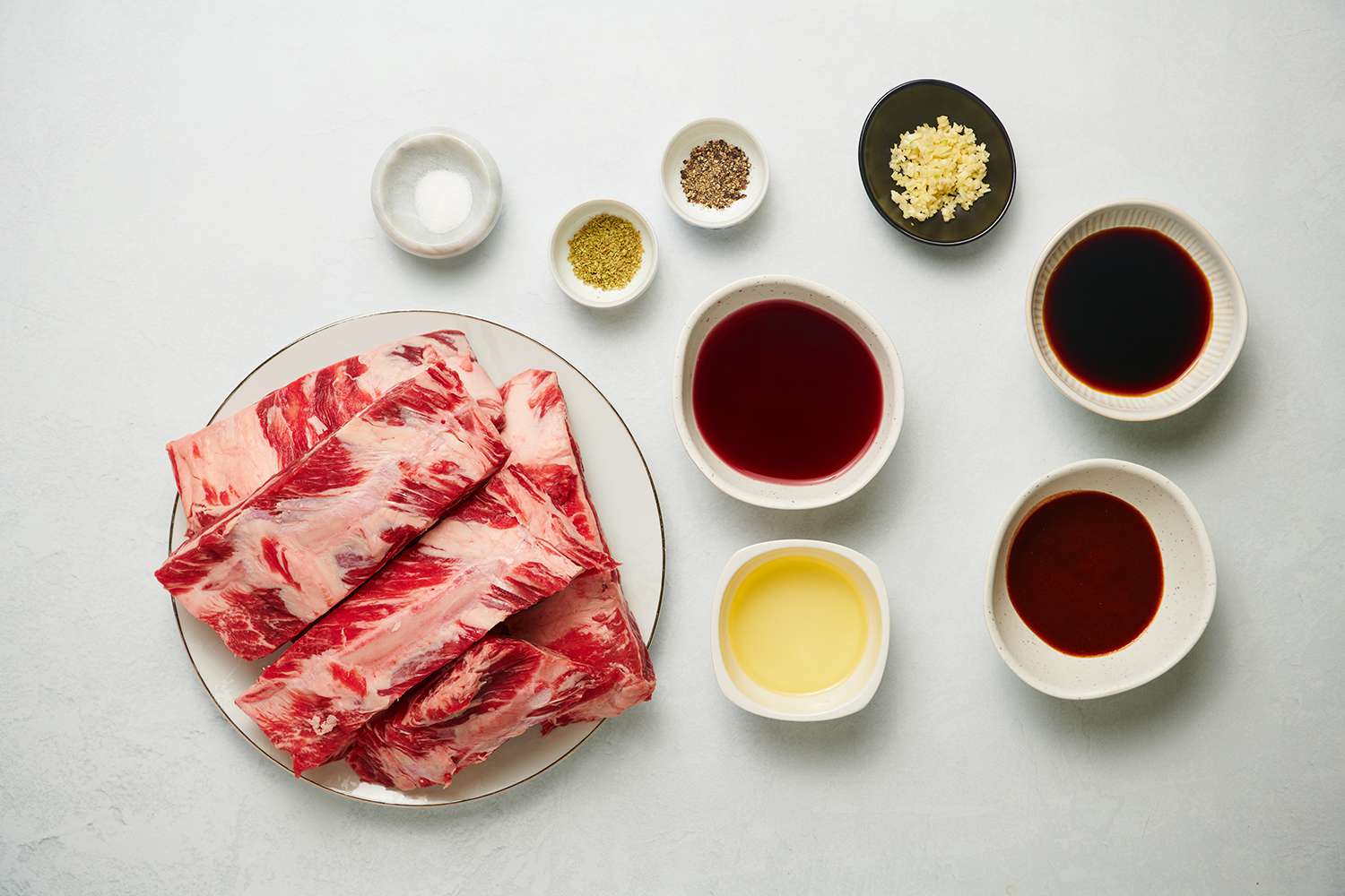 Ingredients for tender slow grilled beef ribs recipe in bowls 