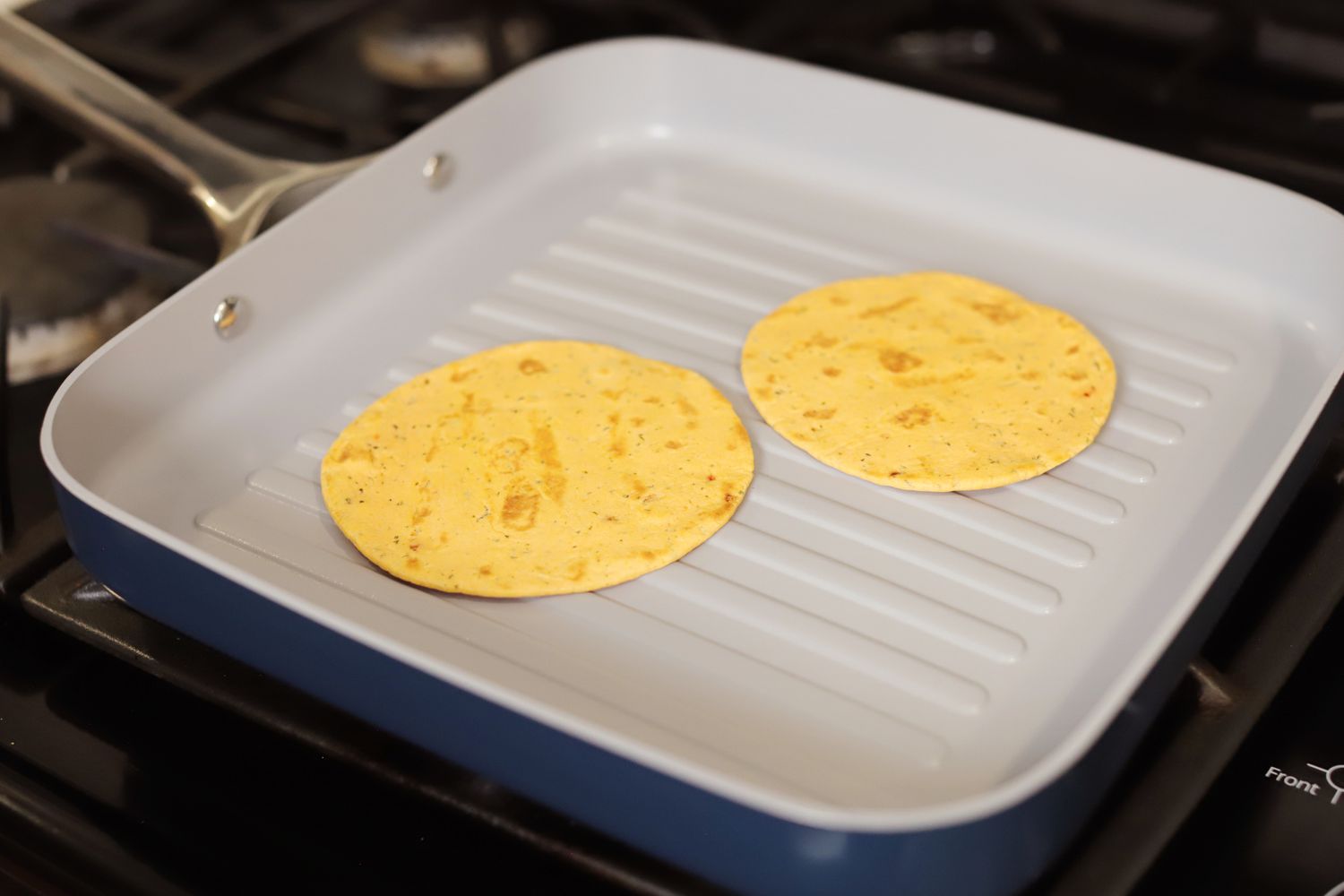 Browning tortillas on the Caraway Griddle Pan