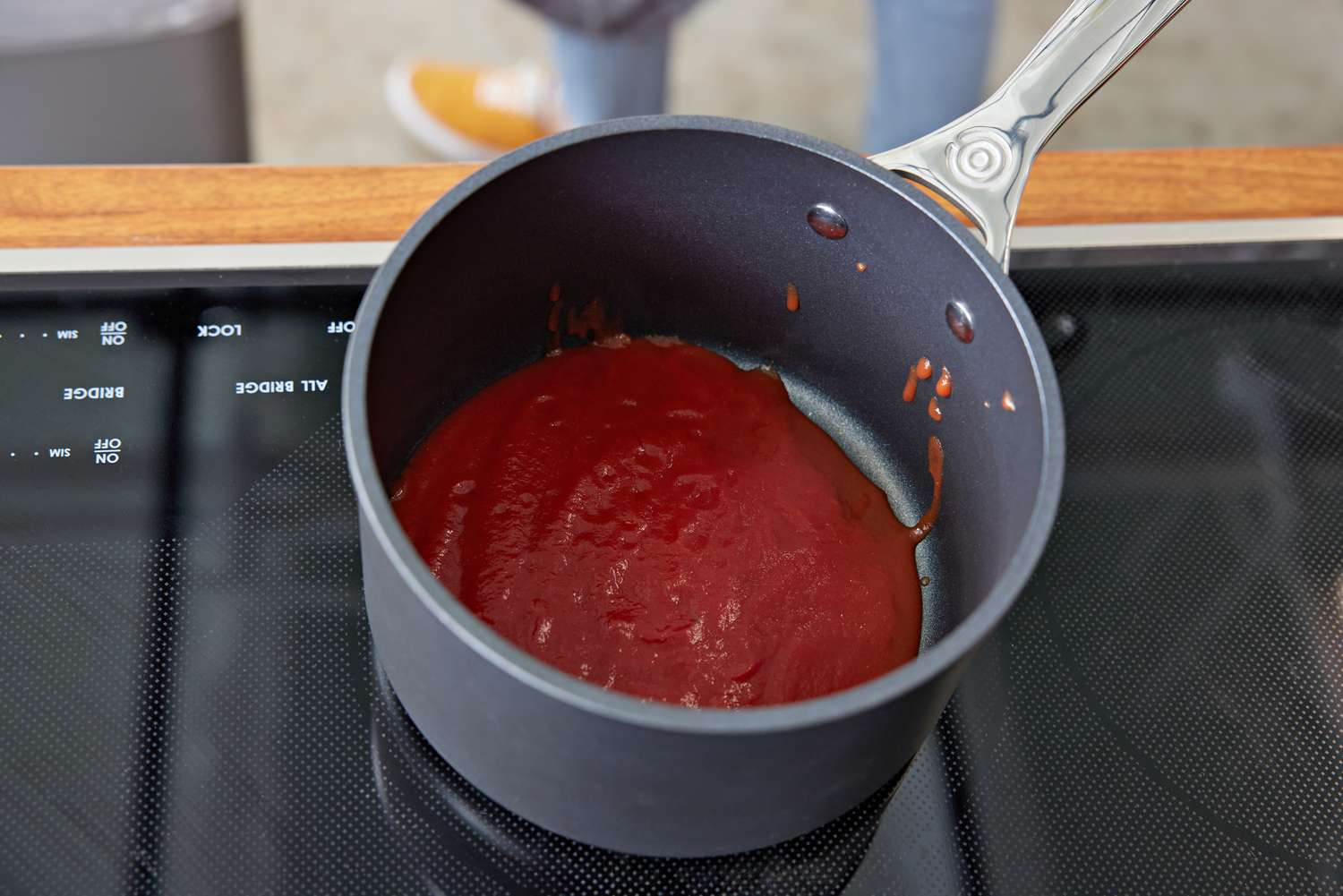 Le Creuset Toughened Nonstick Pro 6-Piece Cookware Set with red sauce inside