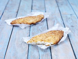 A pair of fried white fish