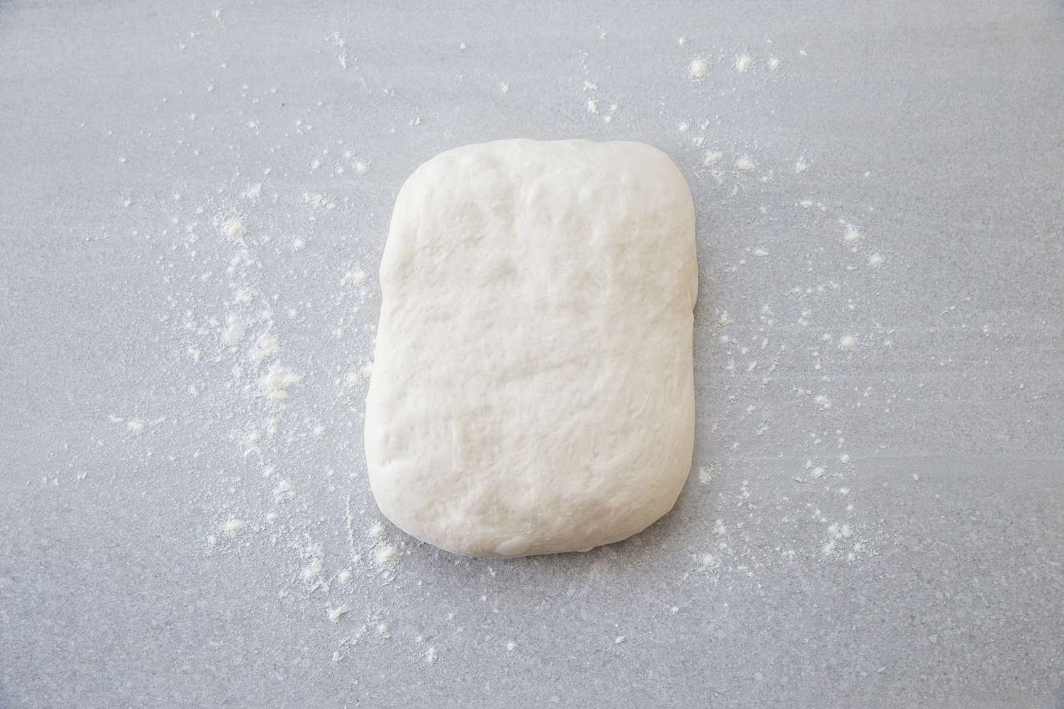 baguette dough on a floured counter 