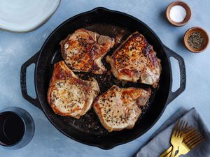 Perfect juicy pork chops cooked in a cast iron skillet