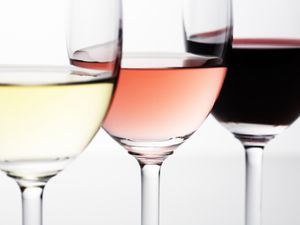 wine glasses with white wine, rose, and red wine