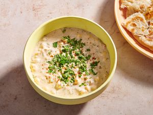 A bowl of cucumber raita served with paratha