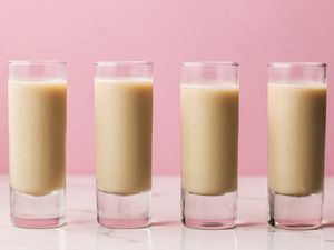 Four shot glasses of Girl Scout Cookie Shot Cocktail