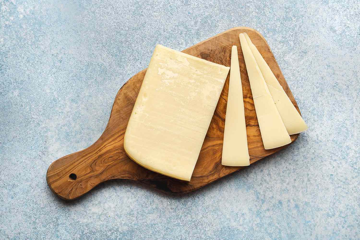 Gruyere cheese on a cutting board