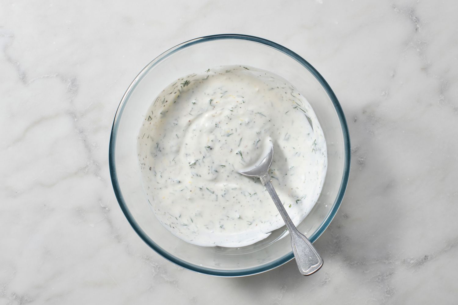 Yogurt spread made with yogurt, dill, lemon juice, zest, salt, and pepper