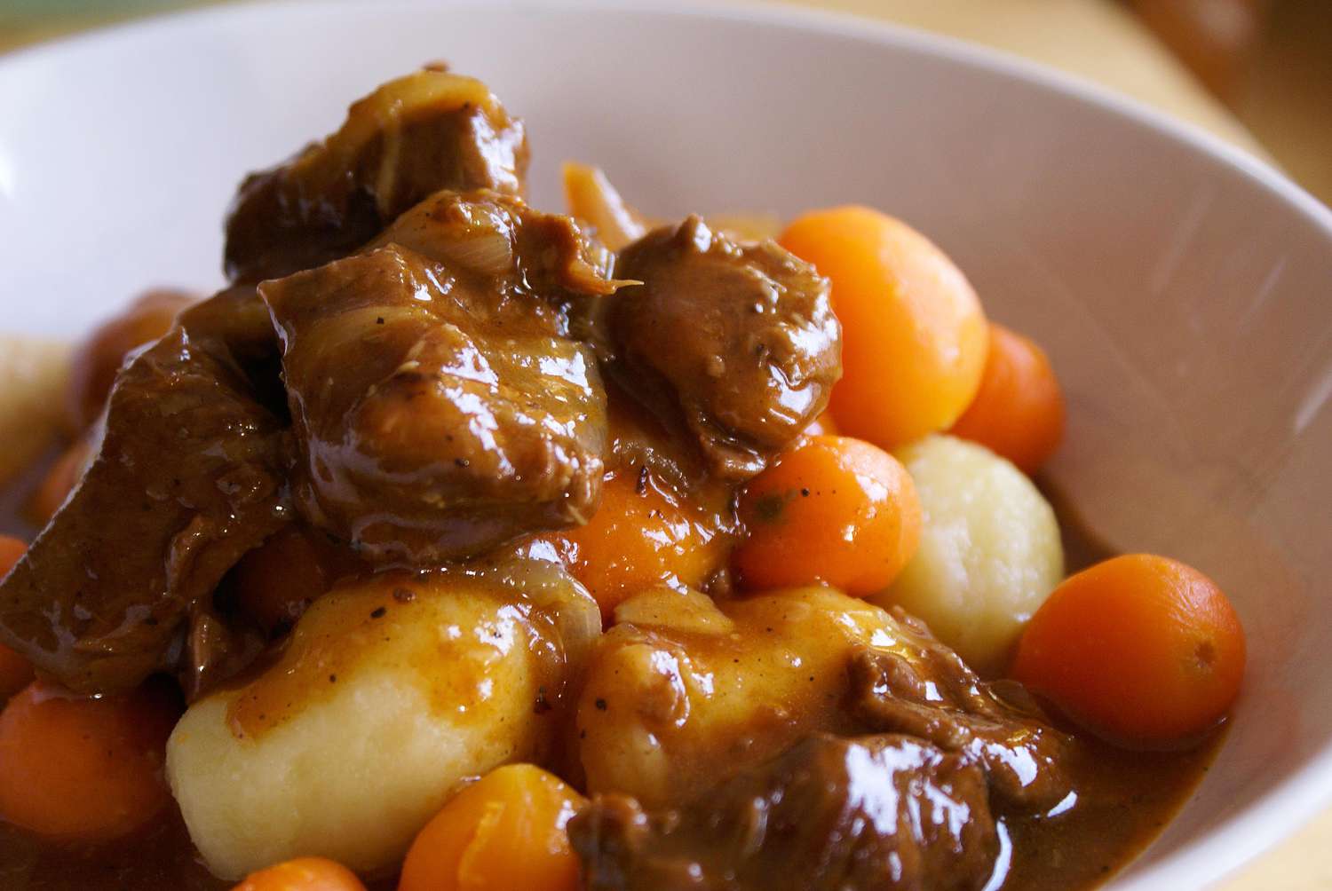 Beef stew with small dumplings and carrots