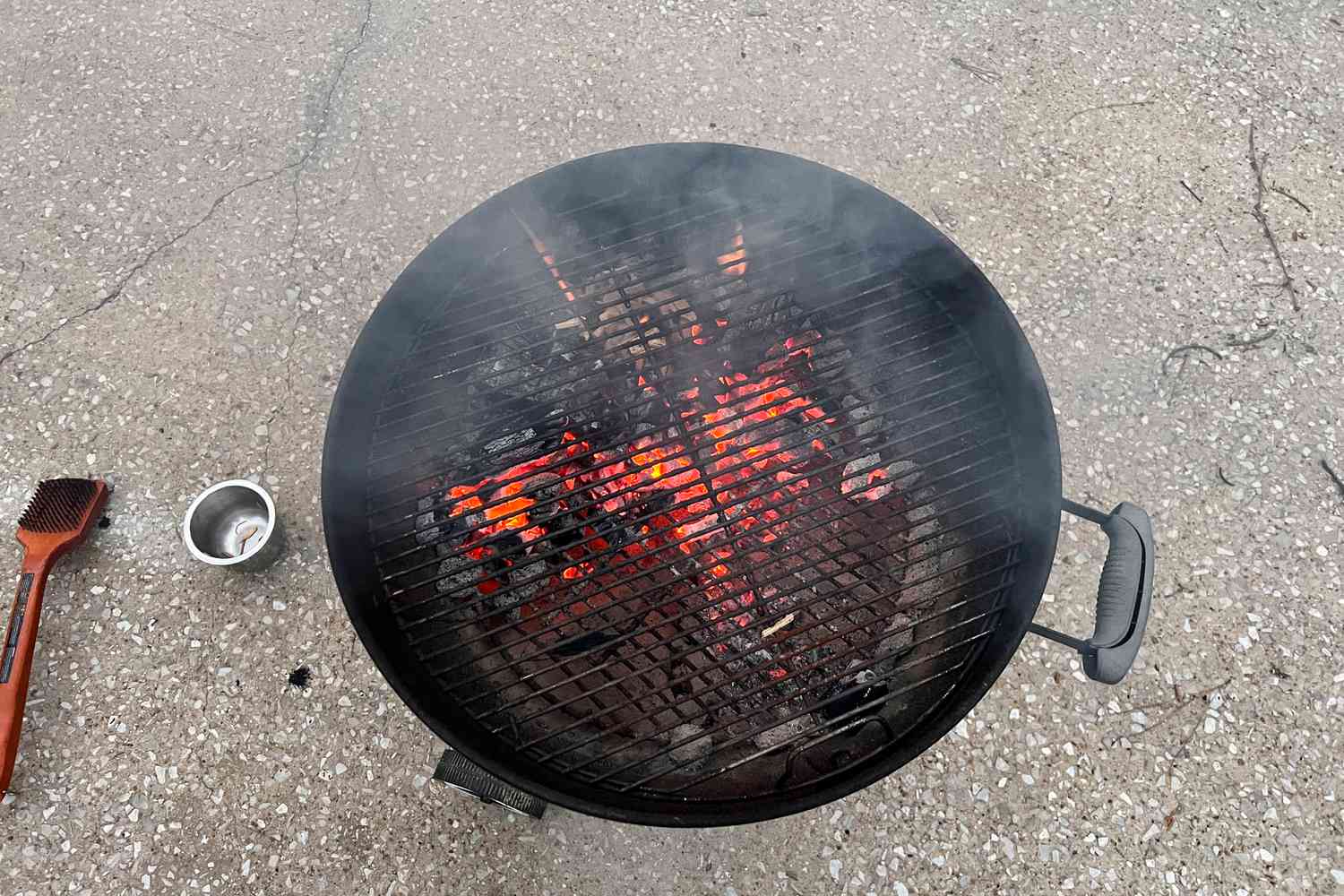 Masterbuilt Lump Charcoal burning in a grill 
