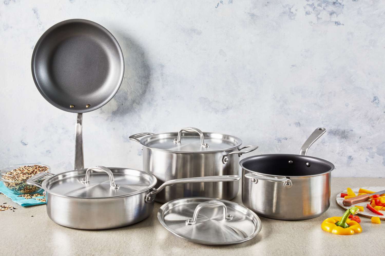 Made In 7-Piece The Non Stick Set displayed on countertop with nearby cut peppers