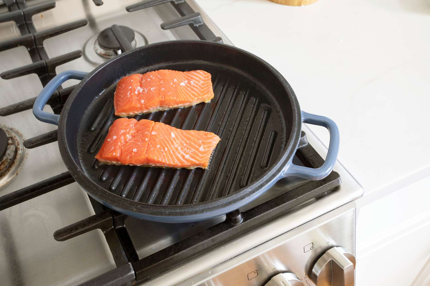 Our Place Grill Pan with Salmon cooking on it