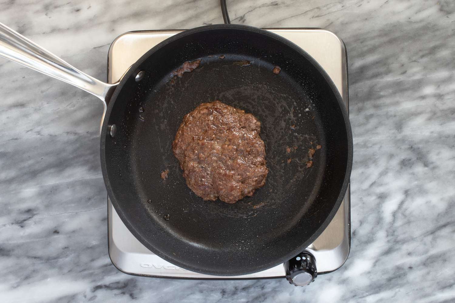 Burger in a skillet.